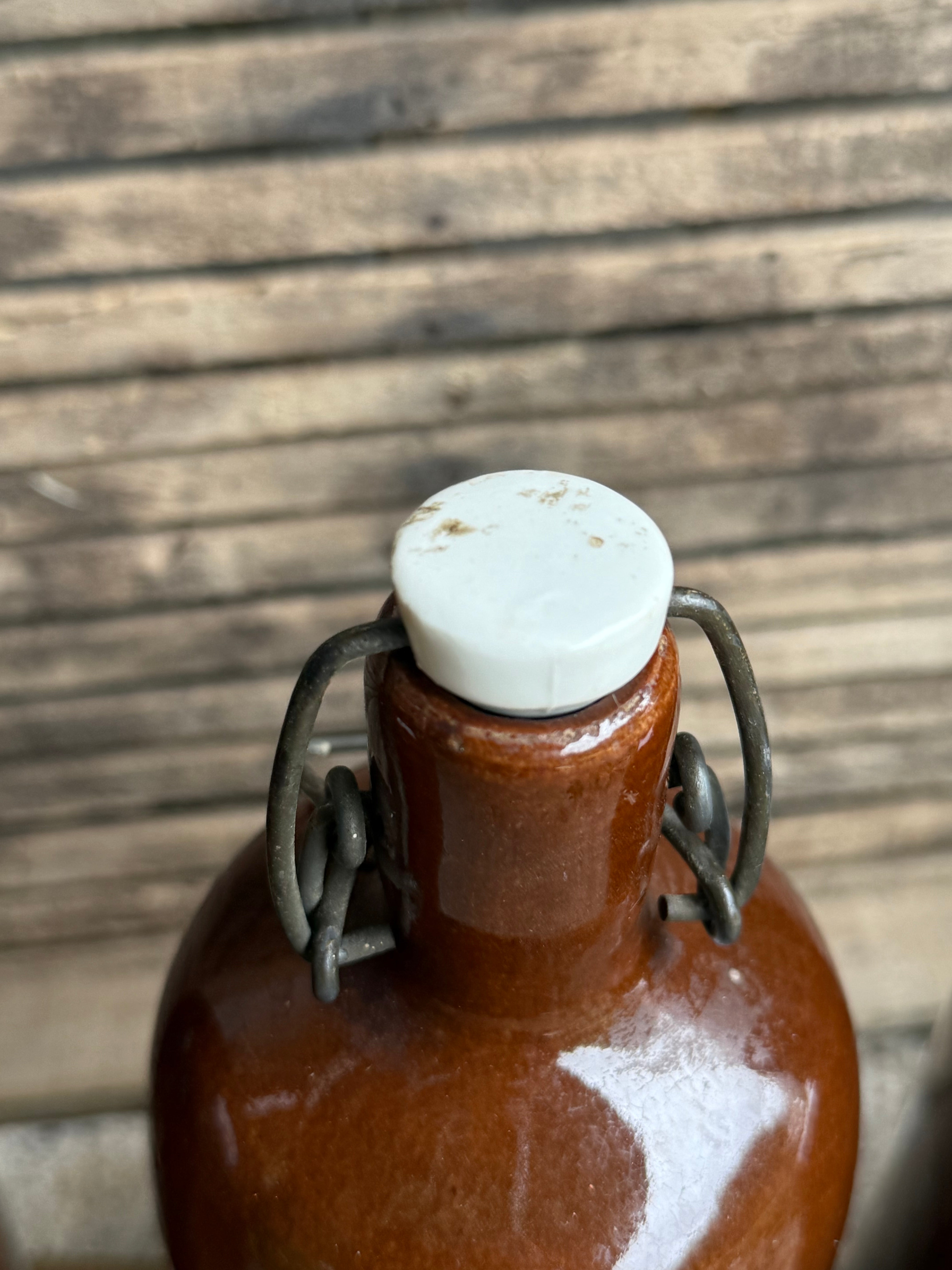 Trio of Stoneware Soda Bottles with Porcelain Swing Stoppers