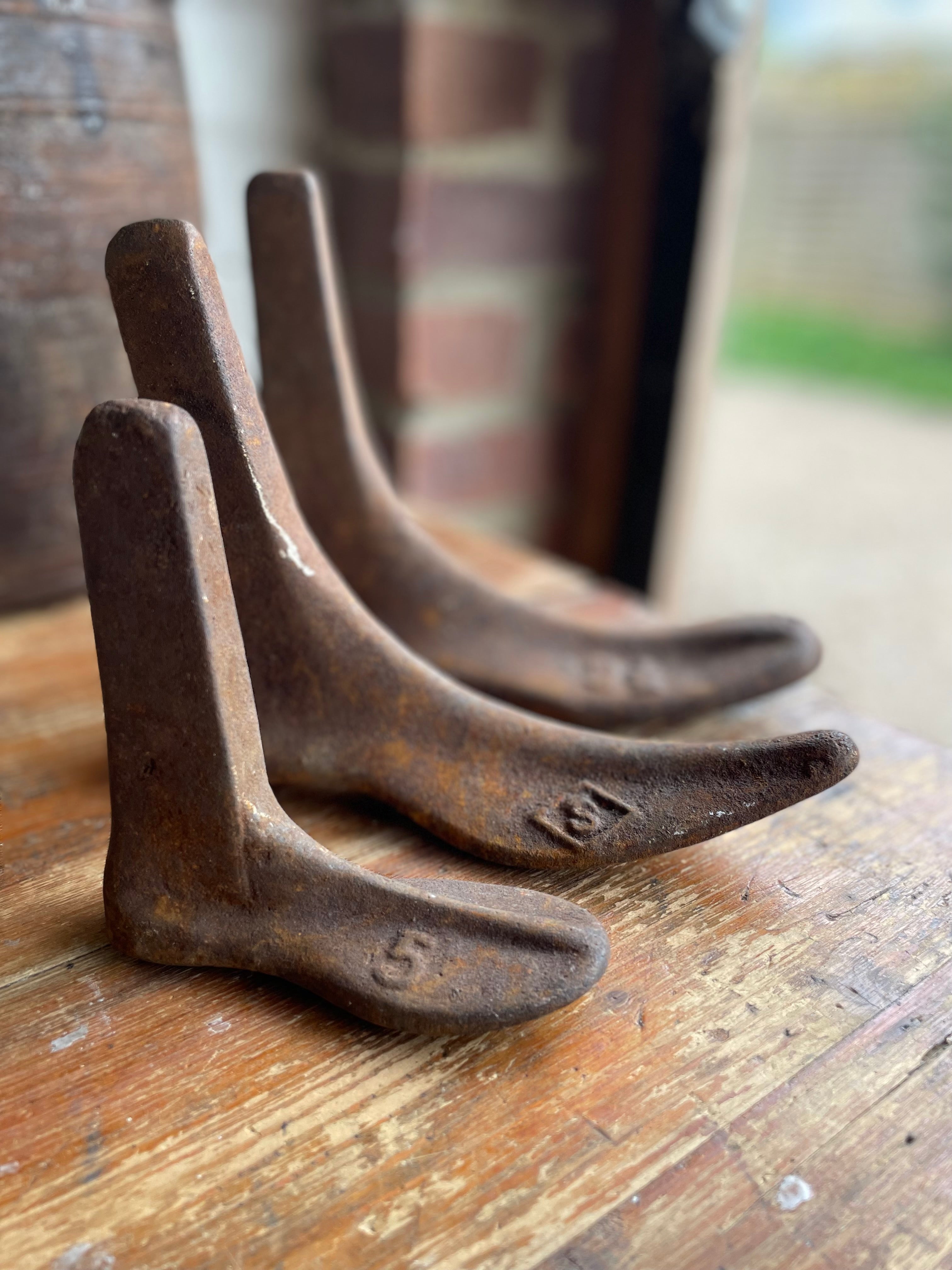 Trio of 19th century Cast Iron Cobblers Boots