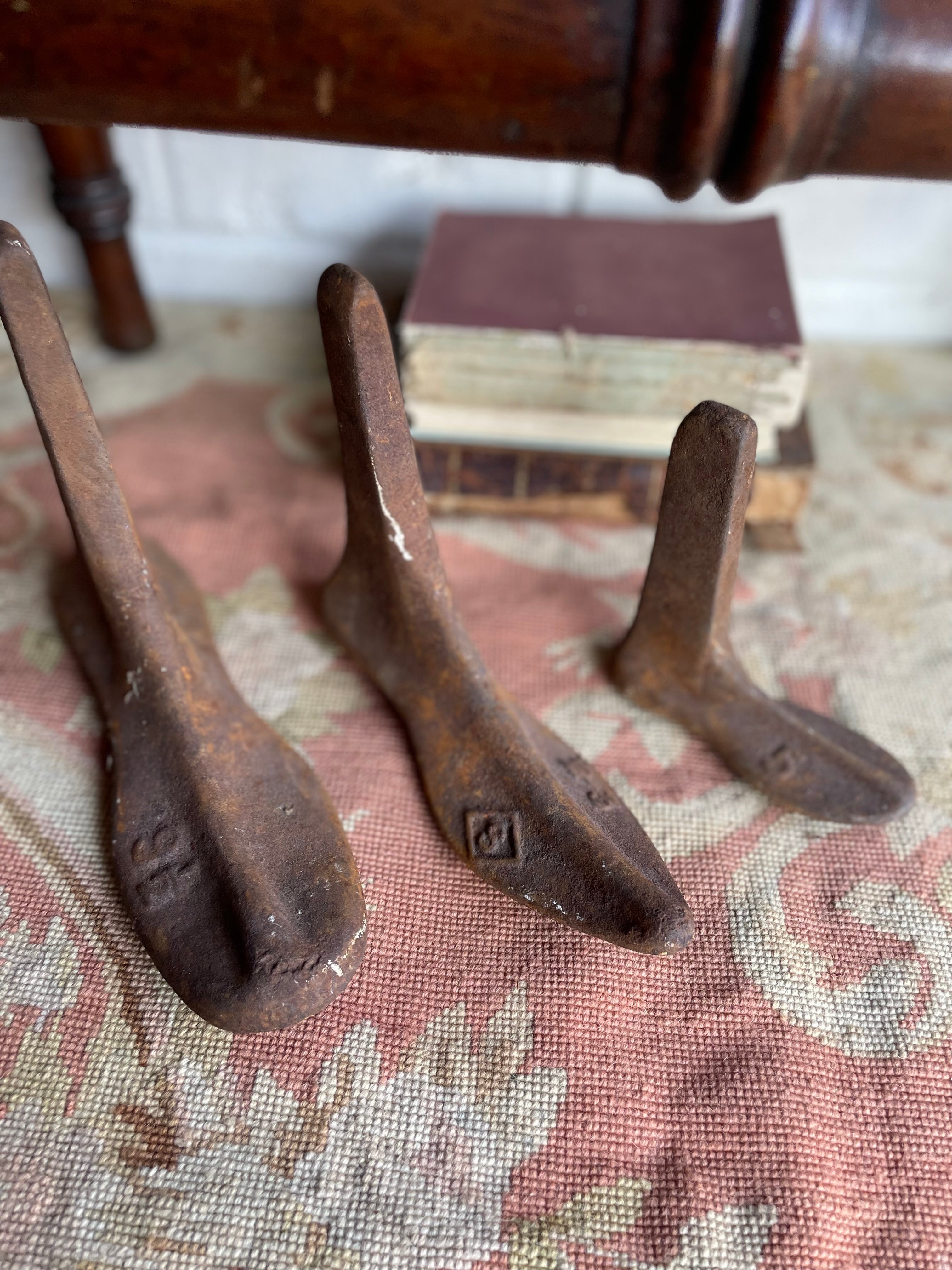 Trio of 19th century Cast Iron Cobblers Boots