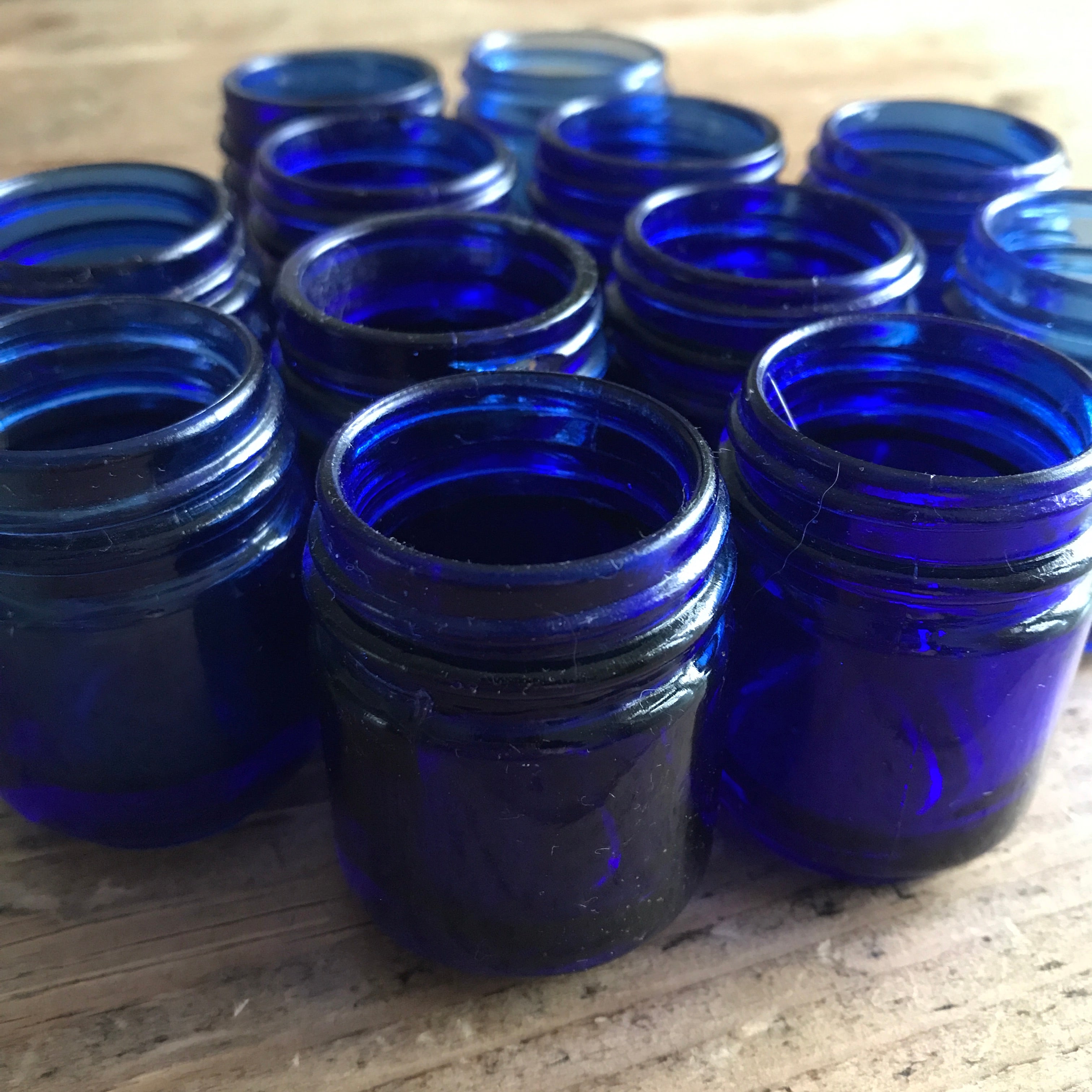 Collection of 12 Vintage Cobalt Blue Glass Vicks Jars