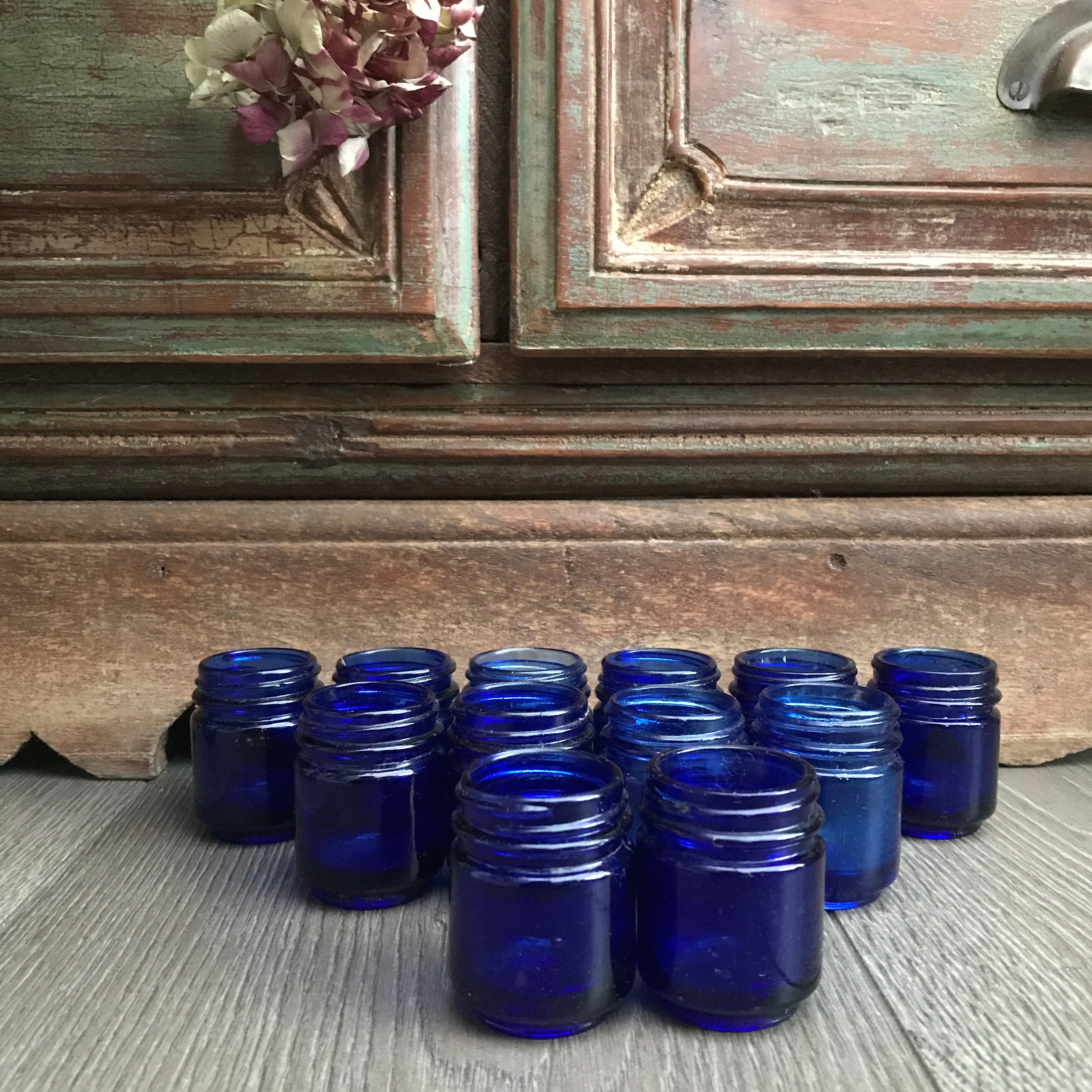 Collection of 12 Vintage Cobalt Blue Glass Vicks Jars