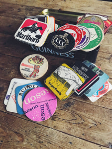Vintage Coasters Collection in a Guinness Tin