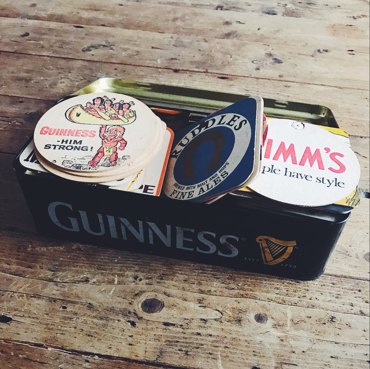 Vintage Coasters Collection in a Guinness Tin