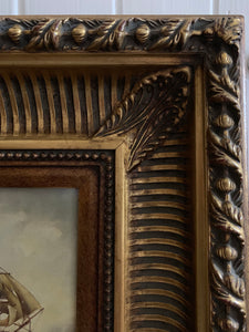 Pair of carved gilt frames with prints depicting 18th century ships