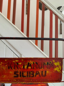 Pair of red/orange metal stacking chairs