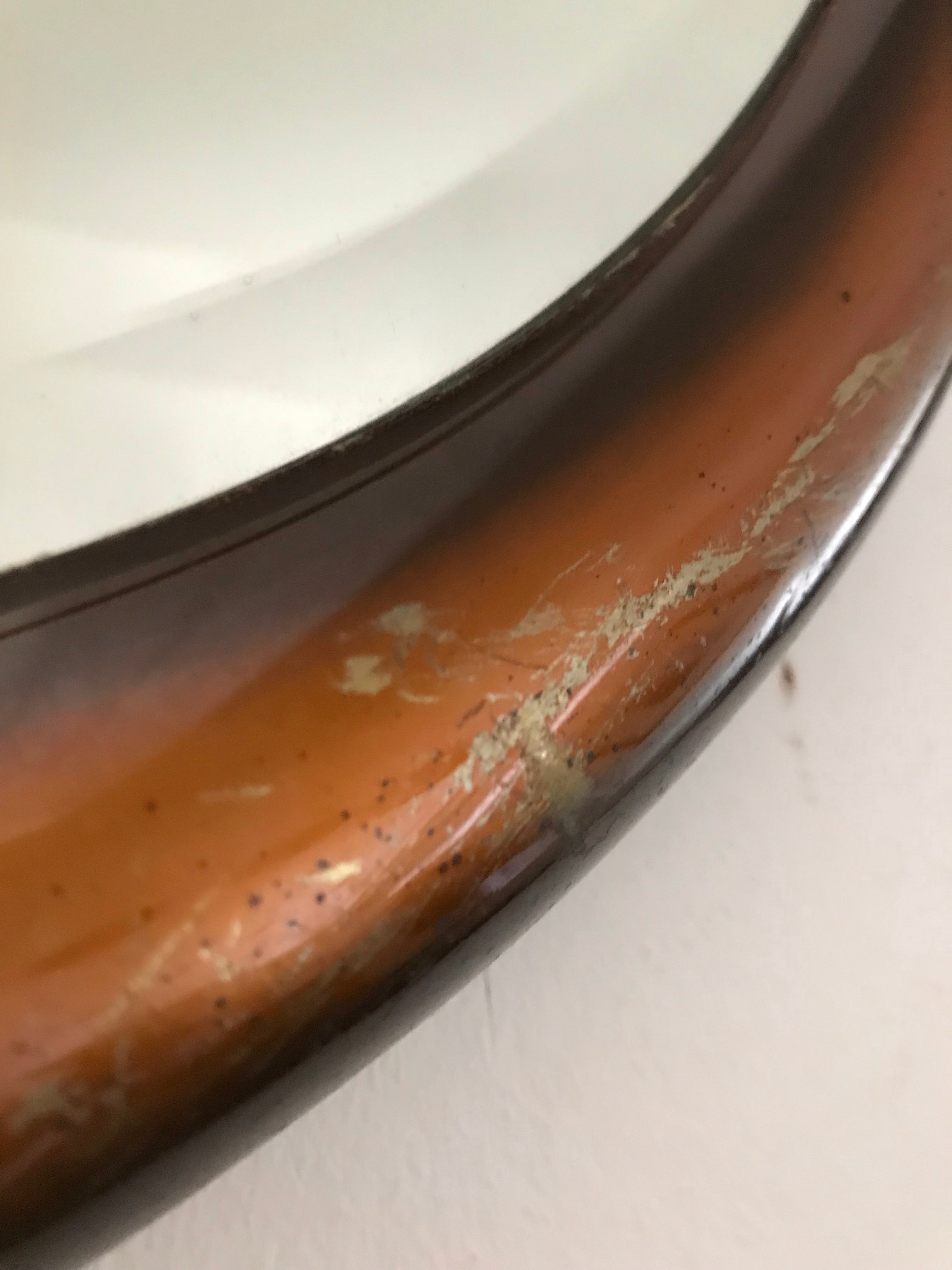 Bronze-coloured metal framed mirror