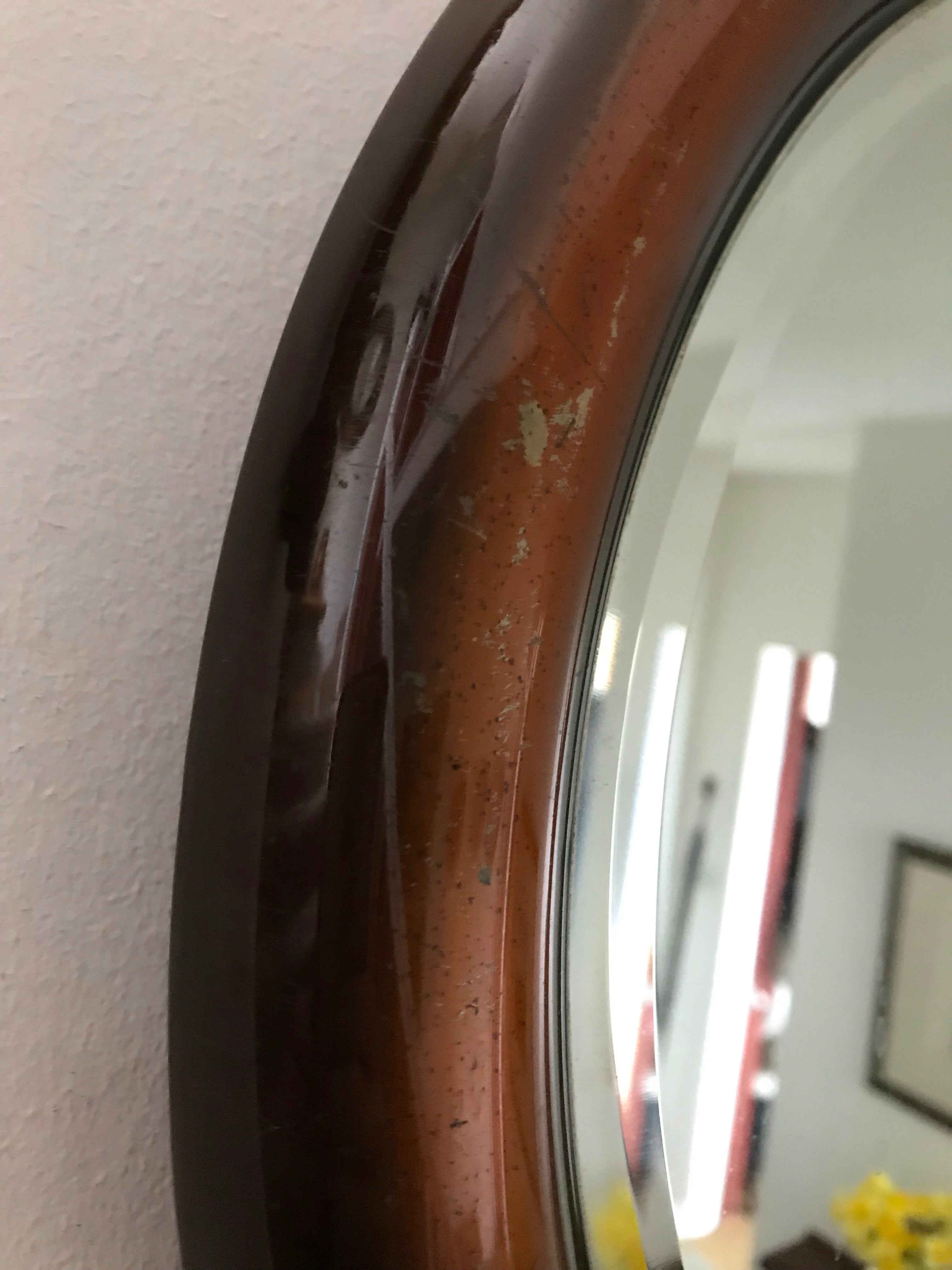 Bronze-coloured metal framed mirror