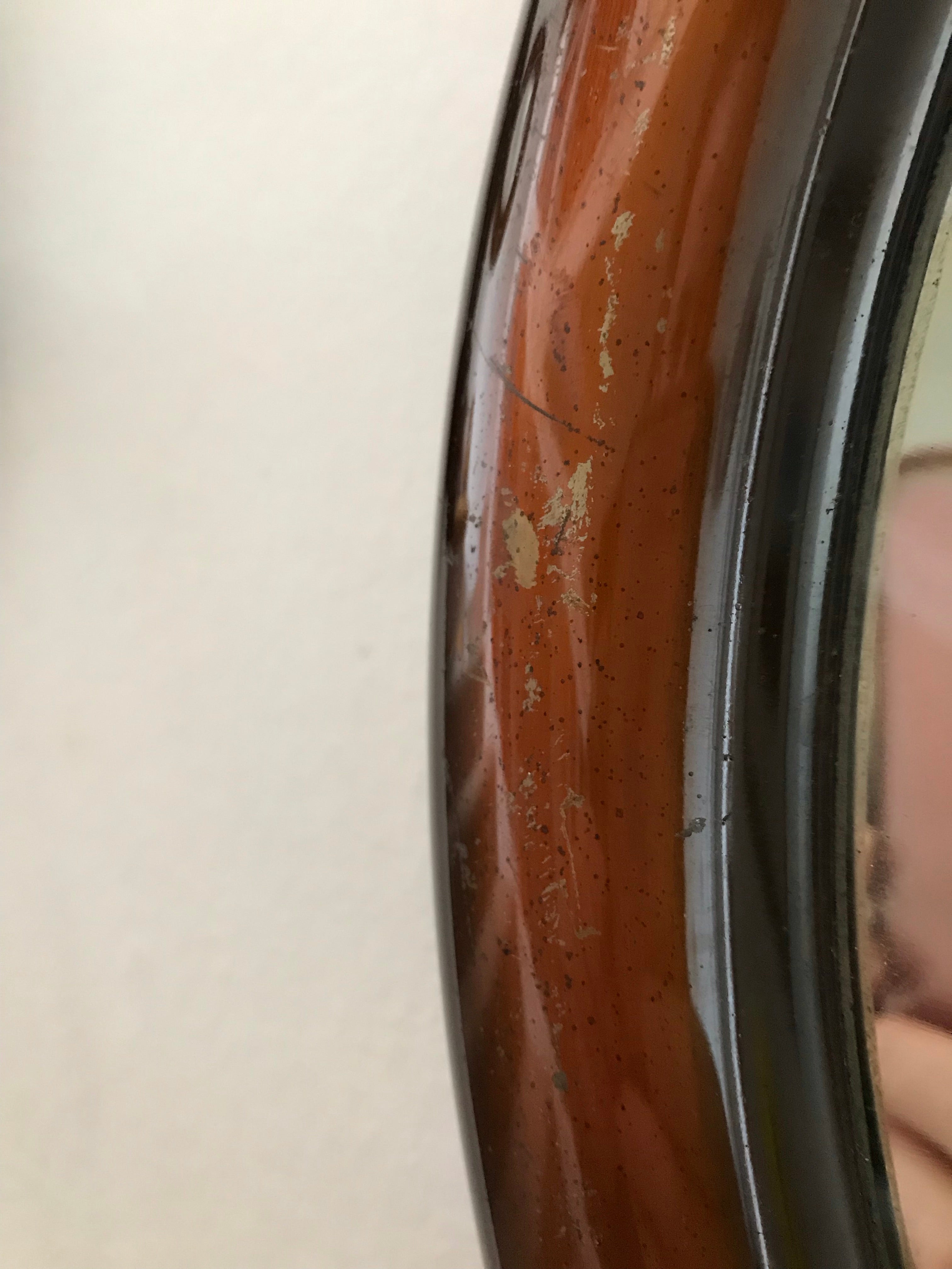 Bronze-coloured metal framed mirror