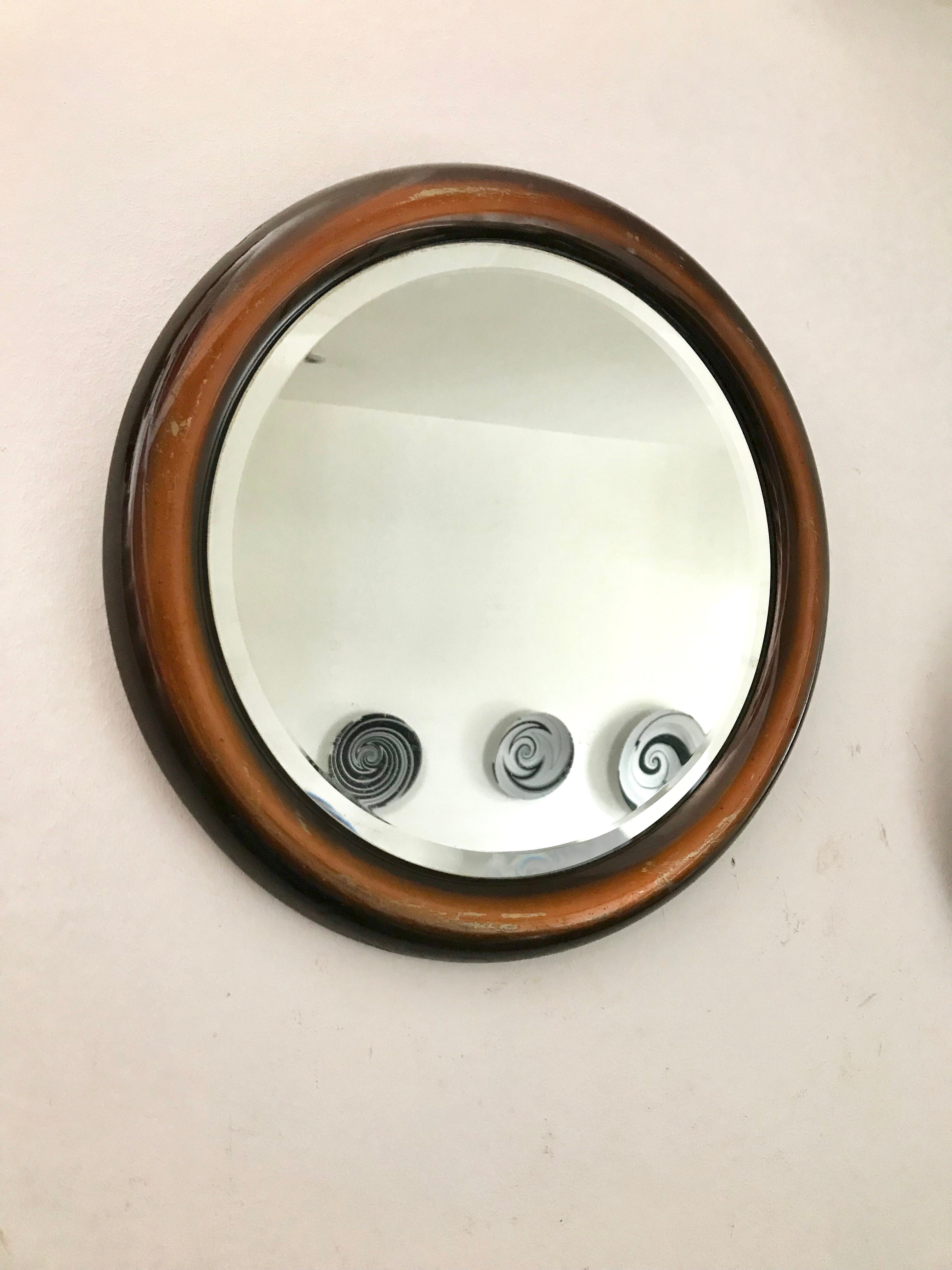 Bronze-coloured metal framed mirror