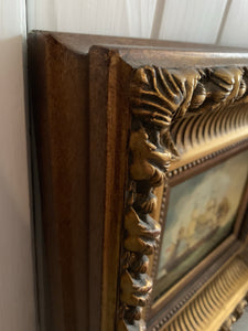 Pair of carved gilt frames with prints depicting 18th century ships